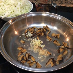 Shiitake, garlic, shrimp cooking in lard