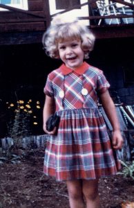 Sally_standing_ in_a_plaid-Dress-red_collar