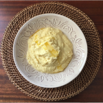 A bowl of mashed turnips, rutabaga and celery root.